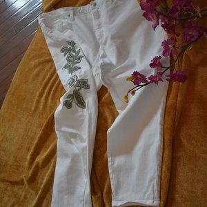 White jeans with sage floral accents